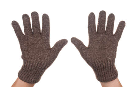 Hands in warm winter gloves on white backgroundの写真素材
