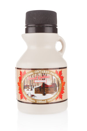 Moscow, Russia - november 01, 2021: Canadian maple syrup plastic bottle on white backgroundのeditorial素材