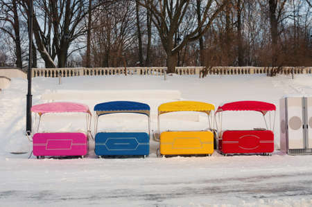 Multicolor empty street stalls in a winter parkの写真素材
