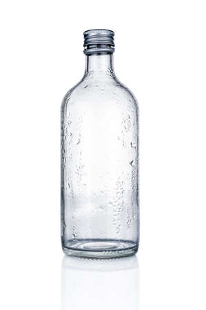 Empty glass bottle close up isolated on white backgroundの写真素材