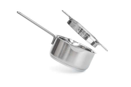 Steel saucepan with glass lid close up isolated on white backgroundの写真素材