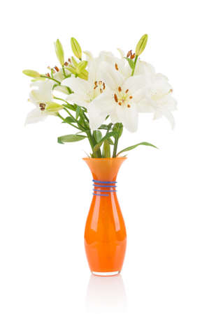 Bouquet of lilies in glass vase isolated on white backgroundの写真素材