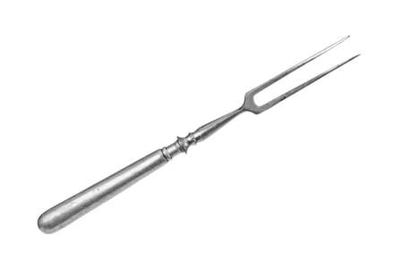 Old fashioned fork close up isolated on white backgroundの写真素材