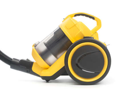 Yellow vacuum cleaner close up isolated on white backgroundの写真素材