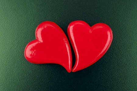 Two red hearts on wooden background. valentines day cardの写真素材