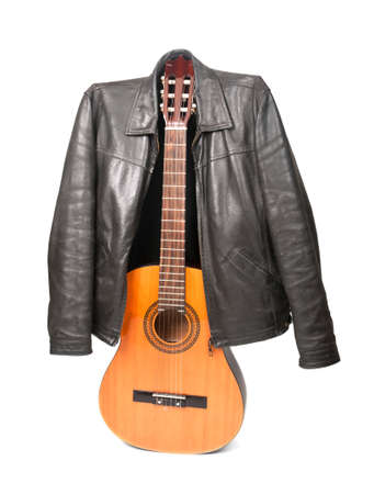 Acoustic guitar and black leather jacket isolated on white backgroundの写真素材