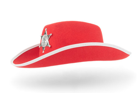 Red sheriff hat with shadow on white backgroundの写真素材