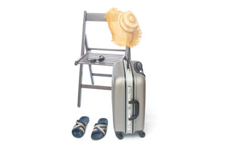 Vacation accessories with wooden chair on white backgroundの写真素材