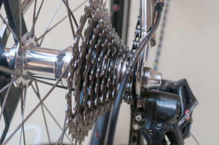 Rear bicycle wheel and gears close upの写真素材