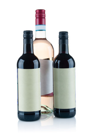 Few red wine bottles close up isolated on white backgroundの写真素材
