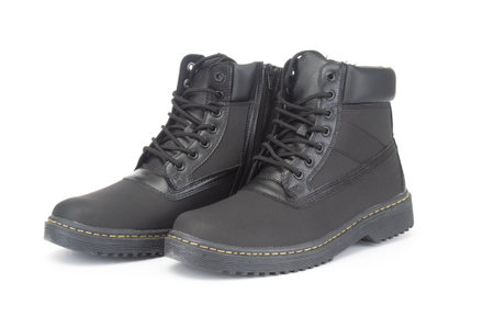 Pair of new winter boots close up on white backgroundの写真素材