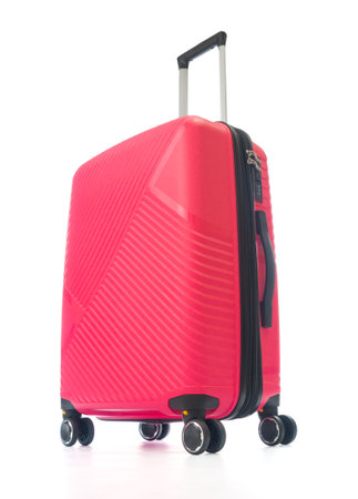 Red plastic travel bag close up on white backgroundの写真素材