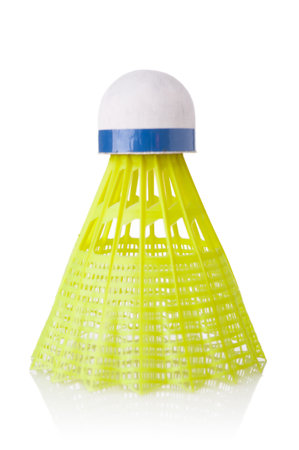 Yellow badminton shuttlecock close up isolated on white backgroundの写真素材