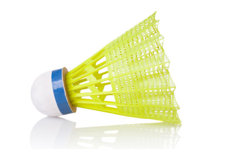Yellow badminton shuttlecock close up isolated on white backgroundの写真素材