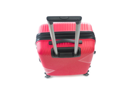 Up view on red travel bag isolated on white background. front focusの写真素材