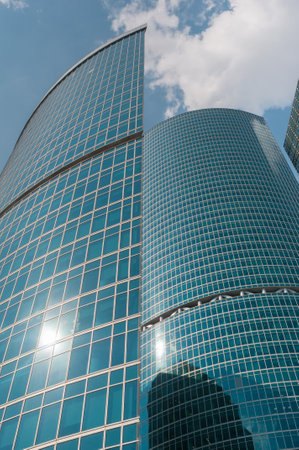 Modern skyscrapers of business center in downtown on blue sky backgroundの写真素材