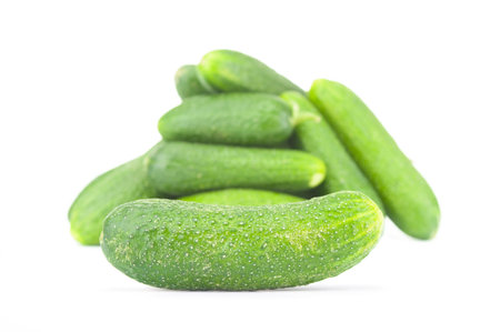 Ripe cucumber close up on a white backgroundの写真素材