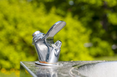 Drinking tap close up in public park in the city at summerの写真素材
