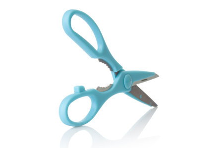 Blue scissors close up isolated on a white backgroundの写真素材