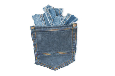 Grunge jeans pocket with denim cuttings isolated on white backgroundの写真素材