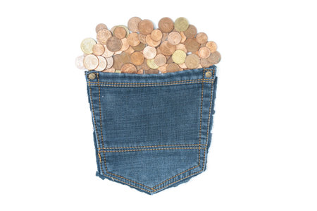 Euro cent coins in grunge jeans pocket isolated on white backgroundの写真素材