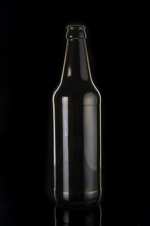Empty beer bottle close up on black backgroundの写真素材