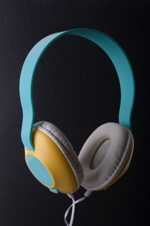 Headphones with cable close up on a black backgroundの写真素材