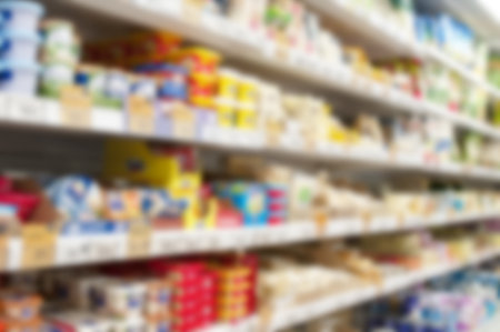 Interior of supermarket with shelves blurred backgroundの写真素材