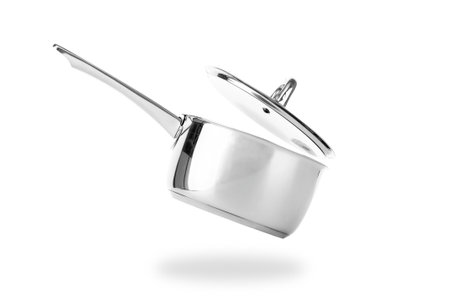 Stainless saucepan with metal lid isolated on white backgroundの写真素材