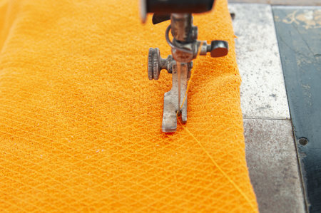 Production of garments with a sewing machine close upの写真素材