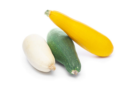 Zucchinis close up on a white backgroundの写真素材