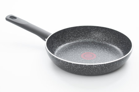 Frying pan close up on a white backgroundの写真素材