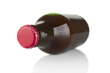 Glass bottle with juice close up on a white backgroundの写真素材