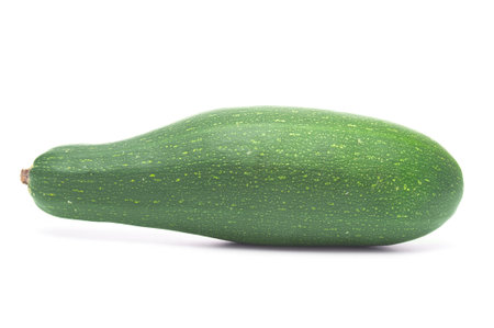 Green zucchini close up on a white backgroundの写真素材