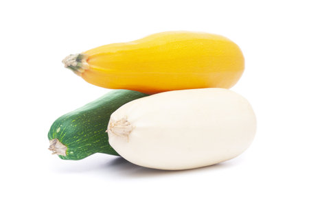 Zucchinis close up on a white backgroundの写真素材