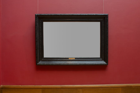 Antique carved picture frame with gray copy space in gallery