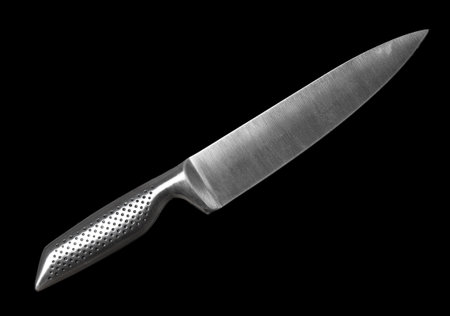 Chef kitchen knife close up on a black backgroundの写真素材