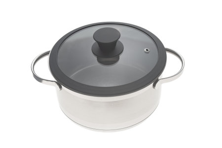 Stainless saucepan with glass lid closeup isolated on white backgroundの写真素材