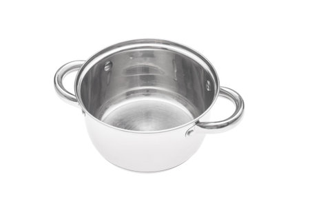 Empty steel saucepan closeup on white backgroundの写真素材