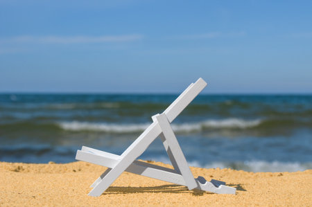 Empty sun lounger at a sandy beachの写真素材