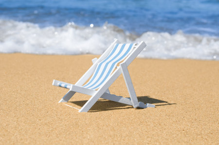 Empty sun lounger at a sandy beachの写真素材