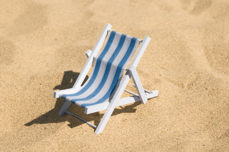 Empty sun lounger at a sandy beachの写真素材