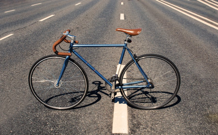 Stylish fixed gear bicycle on a asphalt roadway