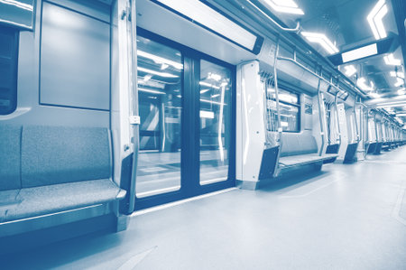 Interior of the modern subway carriage with empty seatsの写真素材