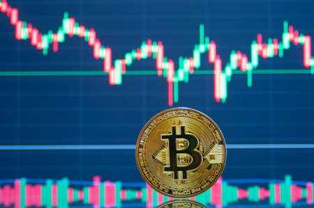 Gold bitcoin crypto coin close up in front of a bitcoin chart