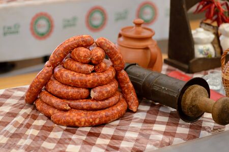 Sausage Festival, Youth teams prepare sausages. Freshly stuffed thin sausages