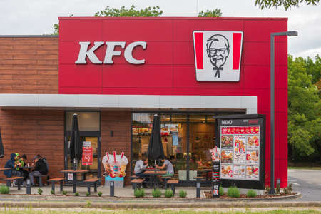 HODMEZOVASARHELY, HUNGARY, 29 AUG 2021 - On the outside terrace of the KFC restaurant, guests eat food.のeditorial素材