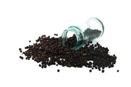 dry black peppercorn inside glass bottle