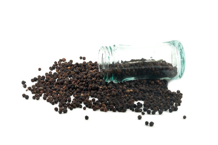 Glass bottle of pepper and black peppercorn