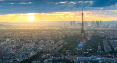 Panorama view of Paris with Eiffel tower  in sunset with warm sky and sun rayのeditorial素材